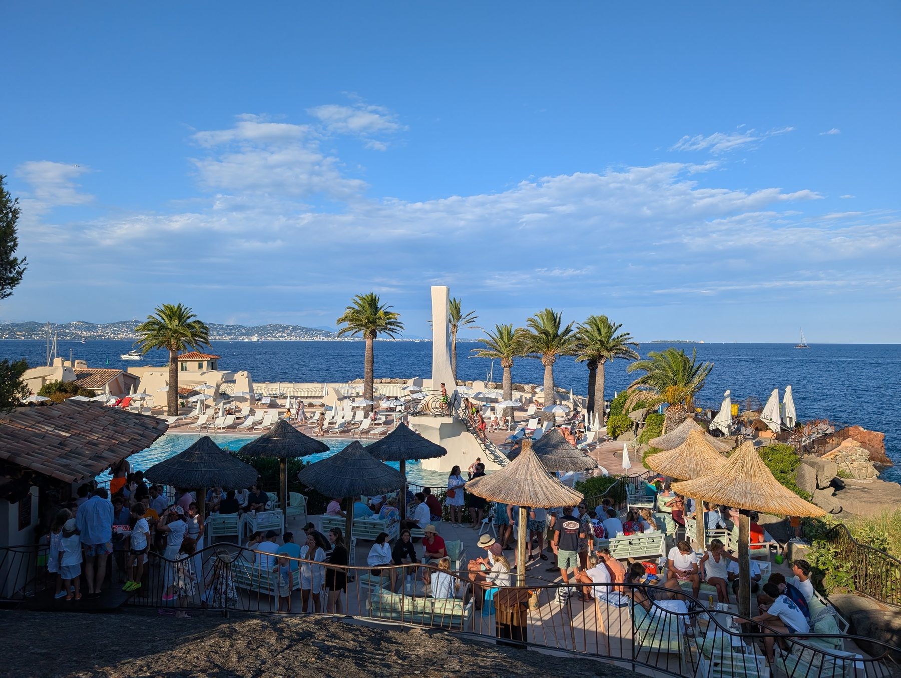 Paillotes at the Summer Club during happy hour, Bay of Cannes behind
