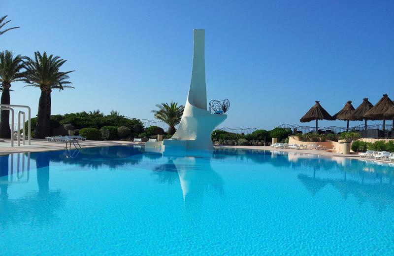 Summer Club swimming pool and white diving tower