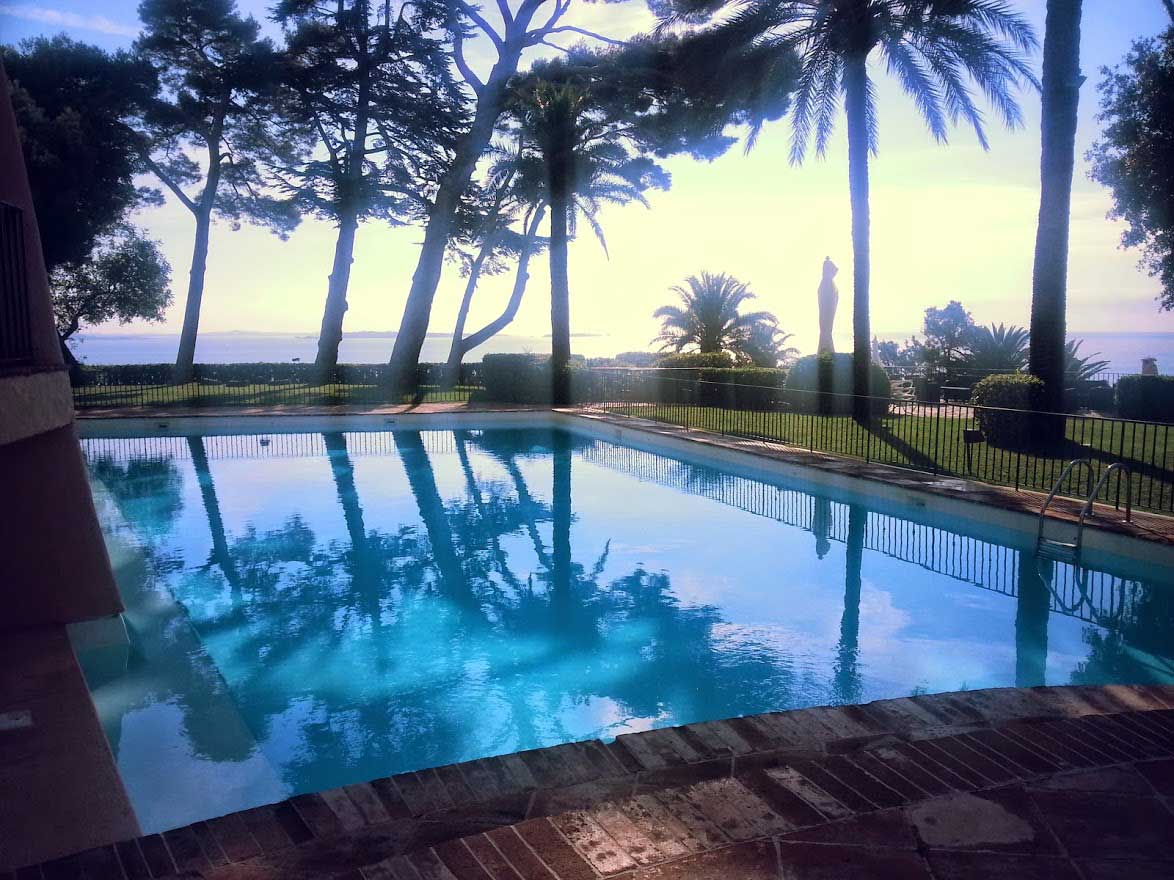 Winter Club pool under pines facing the sea
