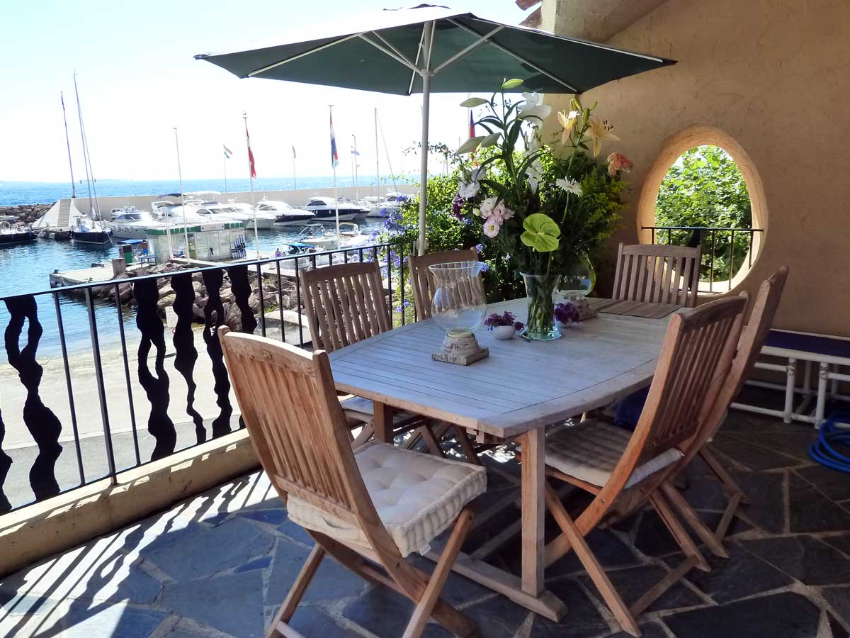 Dining table on the east terrace facing the Port La Galère marina